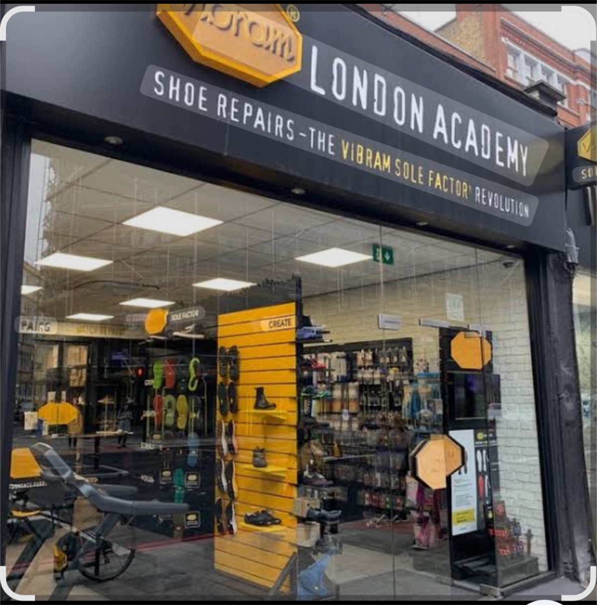 The Vibram London Academy shopfront on City Road, with the wall of coloured Vibram soles and the Sole Factor create bench visible through the glass.